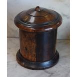 Treen - a 19th century lignum vitae cylindrical string box, turned cover, skirted base, 17cm high,