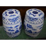 A pair of reproduction Chinese barrel shaped blue and white conservatory seats,