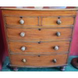 A Victorian mahogany bow front chest, of two short and three long drawers, turned feet, 96cm wide,