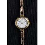 A George V 9ct gold cased bracelet wristwatch, white enamel dial, Roman Numerals, minute track,
