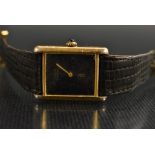 Cartier - a gold plated silver cased wristwatch, rectangular black dial, signed Must De Cartier,