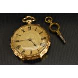 An 18ct gold cased open face fob watch, gilt floral dial, Roman numerals, minute track,