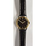 Omega - a 1950's wristwatch, gloss black dial, gilt block baton markers, minute track,