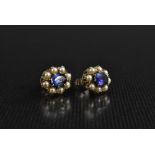 A pair of blue spinel and seed pearl earrings,each with a central oval blue spinel,