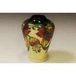 A contemporary Moorcroft baluster vase, tube lined with flowerheads, 11cm high, impressed mark,