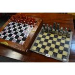 A Chinese chess set, cased, opening to reveal board, another onyx, pieces boxed.