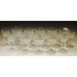 A set of twelve cut glass long stemmed sundae glasses; four conforming wine glasses.