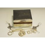 A silver cigarette box, silver pendants, silver earrings, white metal earrings.