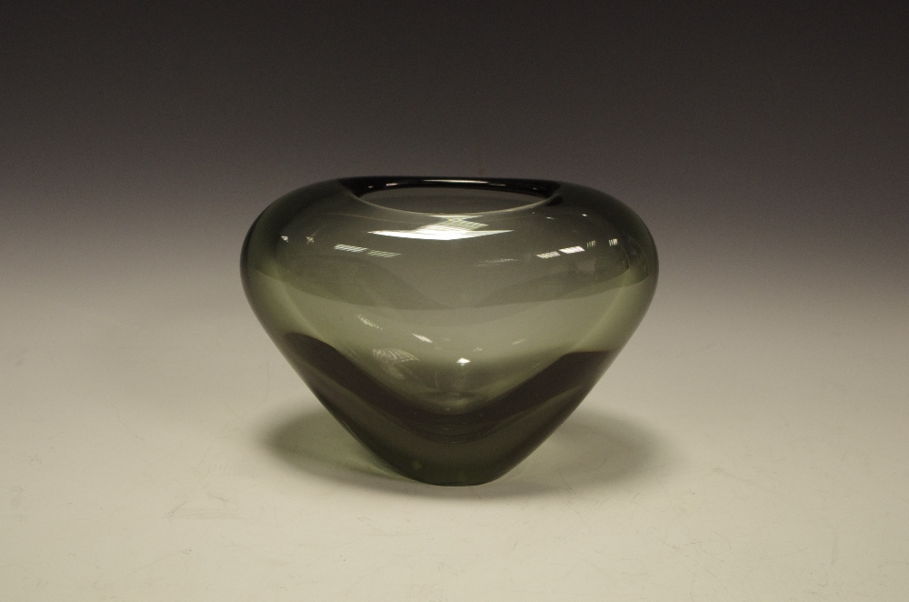 A Holmegaard smoked grey glass flattened ovoid vase, designed by Per Lutken, 20cm wide,