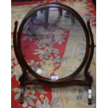 A 19th century mahogany oval dressing mirror, c.