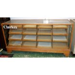 A mid 20th century shop display cabinet, glazed top, front and sides,