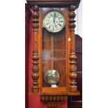 A late 19th century walnut wall clock, probably German, c.