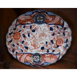 A Japanese shaped oval dish, painted in the Imari palette, 36.