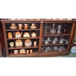 A 20th century oak bookcase, moulded rectangular top above an arrangement of shelves, plinth base,