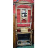 A 20th century oak hall stand, outswept cornice above a rectangular mirror,