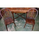 A 20th century oak dining table, moulded top with fall leaves, spirally turned legs, X-stretcher,