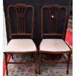 A pair of Edwardian mahogany salon side chairs, serpentine cresting rails, stuffed over seats,