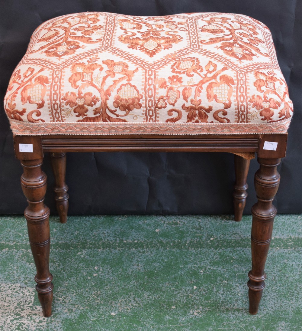 An early 20th century mahogany stool, stuffed over upholstery, turned tapered legs,