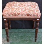 An early 20th century mahogany stool, stuffed over upholstery, turned tapered legs,
