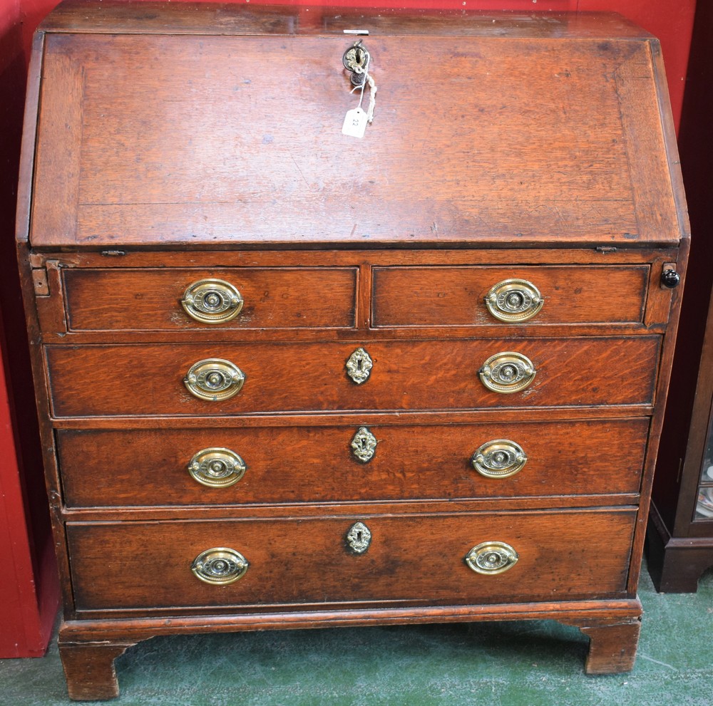 A George III oak bureau,