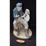 A Lladro figure group, Fisherman and Boy,