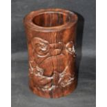A modern Chinese hardwood brush pot, carved with Buddha,