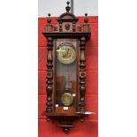 A 20th century mahogany cased Vienna type wall clock, 18cm dial with bold Arabic numerals,