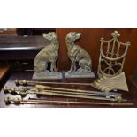 A pair of brass fireside dogs;