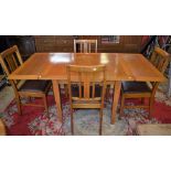 A 20th century light oak drawer-leaf dining table;