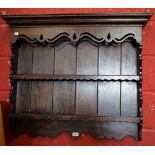 An oak wall hanging shelf/plate rack, 92.