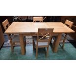 A contemporary light oak extending dining table, extends to 164.