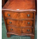 A reproduction serpentine chest of drawers, of small proportions, 54.