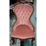 A Victorian mahogany spoonback nursing chair, deep buttoned upholstery,
