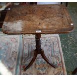 A 19th century mahogany occasional table, rounded rectangular tilting top, turned column,