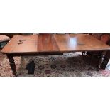 A late Victorian/Edwardian mahogany extending dining table, rounded rectangular moulded top,