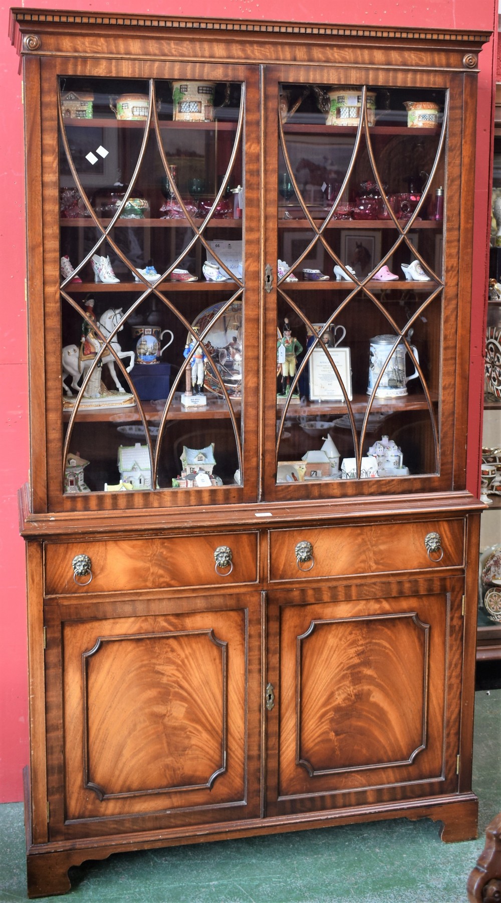 A reproduction mahogany bookcase,