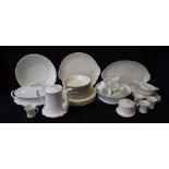 A Limoges plain white porcelain dinner service for twelve comprising dinner plates, salad plates,