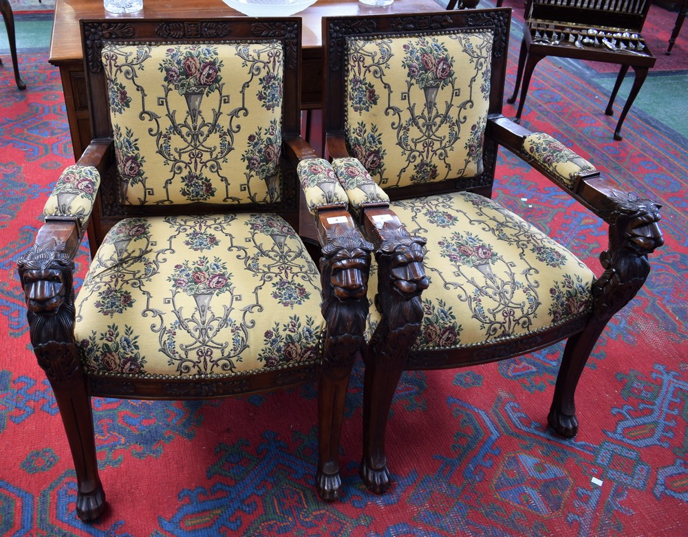 A pair of Empire style mahogany framed library chairs,