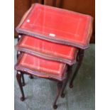 A 20th century mahogany nest of three tables