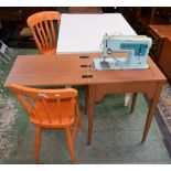 Two Victorian orange painted kitchen chairs; a white painted kitchen table;