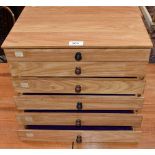 A hand made counter top six drawer cabinet chest,