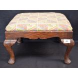 A 20th century oak footstool, cabriole legs, pad feet,