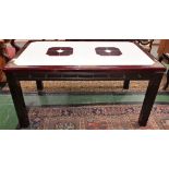A contemporary dining table, rounded rectangular reconstituted marble top, rounded square legs,