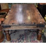An Indian style coffee table, rectangular studded top above a bracket bound frieze,