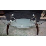 A 20th century retro style oval two tier glass coffee table, 110.