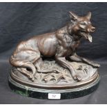French School, after, a bronzed model, of a hound, oval base, 32.