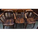 A pair of 20th century elm elbow chairs,