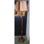 A 20th century mahogany standard lamp, turned, fluted and reeded column, stepped circular base,