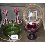 A pair of Bohemian flash cut and enamelled candle sticks; a cut ruby glass urn;