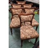 A set of six 19th century mahogany dining chairs, curved cresting rails, stuffed over upholstery,